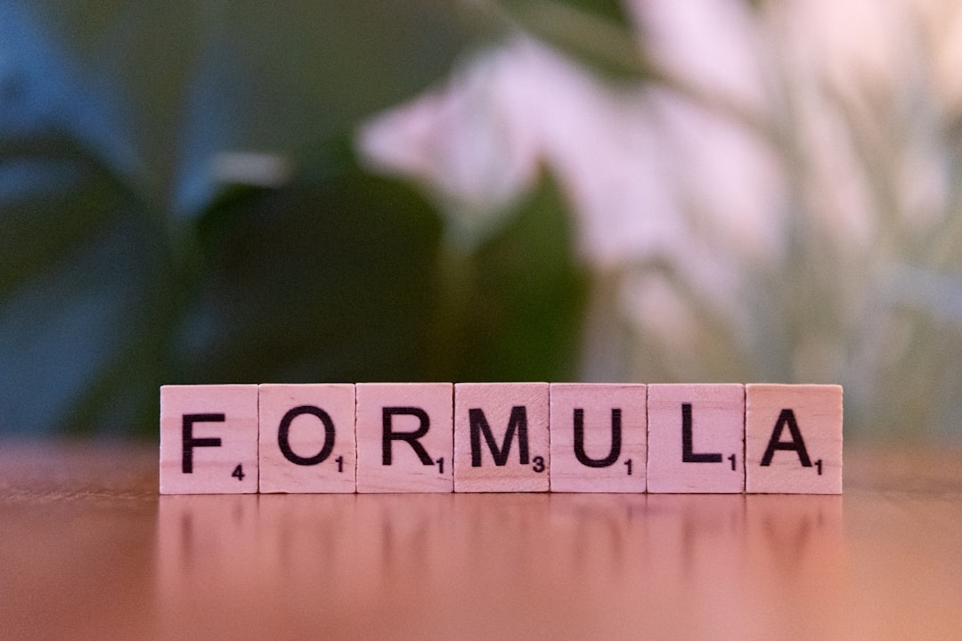 A close up of a scrabble type word on a table